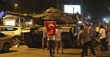 People attempt to stop tanks commanded by putschists, Ankara, Türkiye, July 16, 2016. (AP Photo)