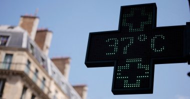A pharmacy sign displays a temperature of 37 degrees Celsius as temperatures rise, Paris, France, June 19, 2026. (Reuters Photo)