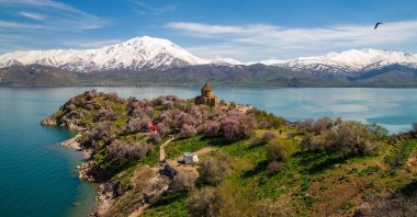 An undated view of an historical church and blooming trees on the shores of Lake Van, Van, Türkiye. (Shutterstock Photo)