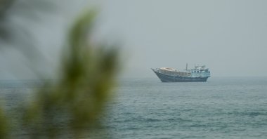 A vessel waits in the Strait of Hormuz, as seen from Musandam, Oman, July 14, 2026. (Reuters Photo)