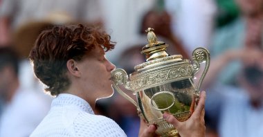 Italy's Jannik Sinner celebrates with the Wimbledon trophy after winning his final match against Germany's Alexander Zverev at All England Lawn Tennis and Croquet Club, London, U.K., July 12, 2026. (Reuters Photo)