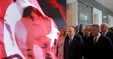 MHP leader Devlet Bahçeli (C) visits an exhibition at Parliament, Ankara, Türkiye, July 14, 2026. (AA Photo)