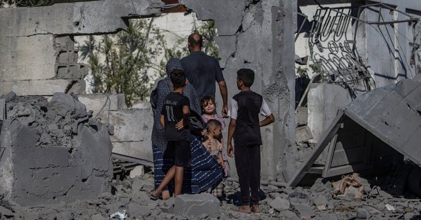 A Palestinian family stands next to their destroyed house following an Israeli airstrike in southern Gaza City, Palestine, July 12, 2026. (EPA Photo)