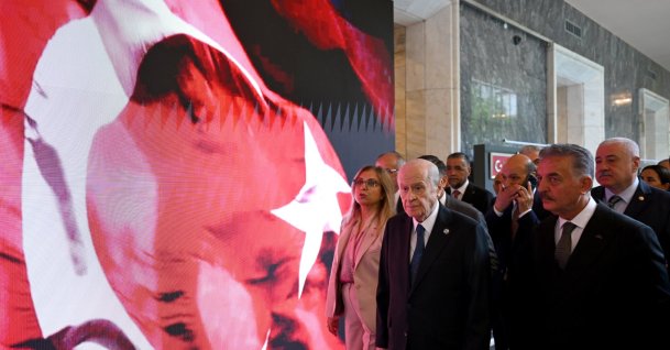 MHP leader Devlet Bahçeli (C) visits an exhibition at Parliament, Ankara, Türkiye, July 14, 2026. (AA Photo)