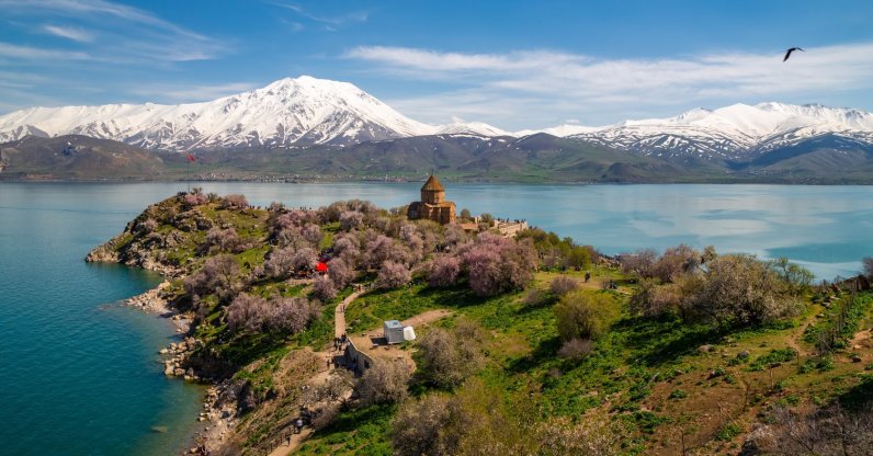 An undated view of an historical church and blooming trees on the shores of Lake Van, Van, Türkiye. (Shutterstock Photo)