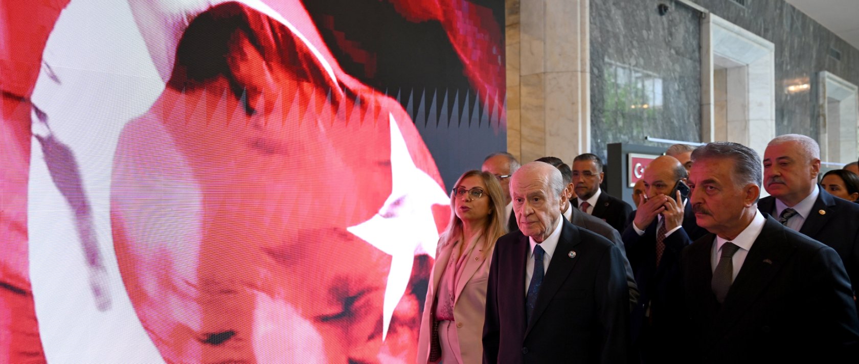 MHP leader Devlet Bahçeli (C) visits an exhibition at Parliament, Ankara, Türkiye, July 14, 2026. (AA Photo)