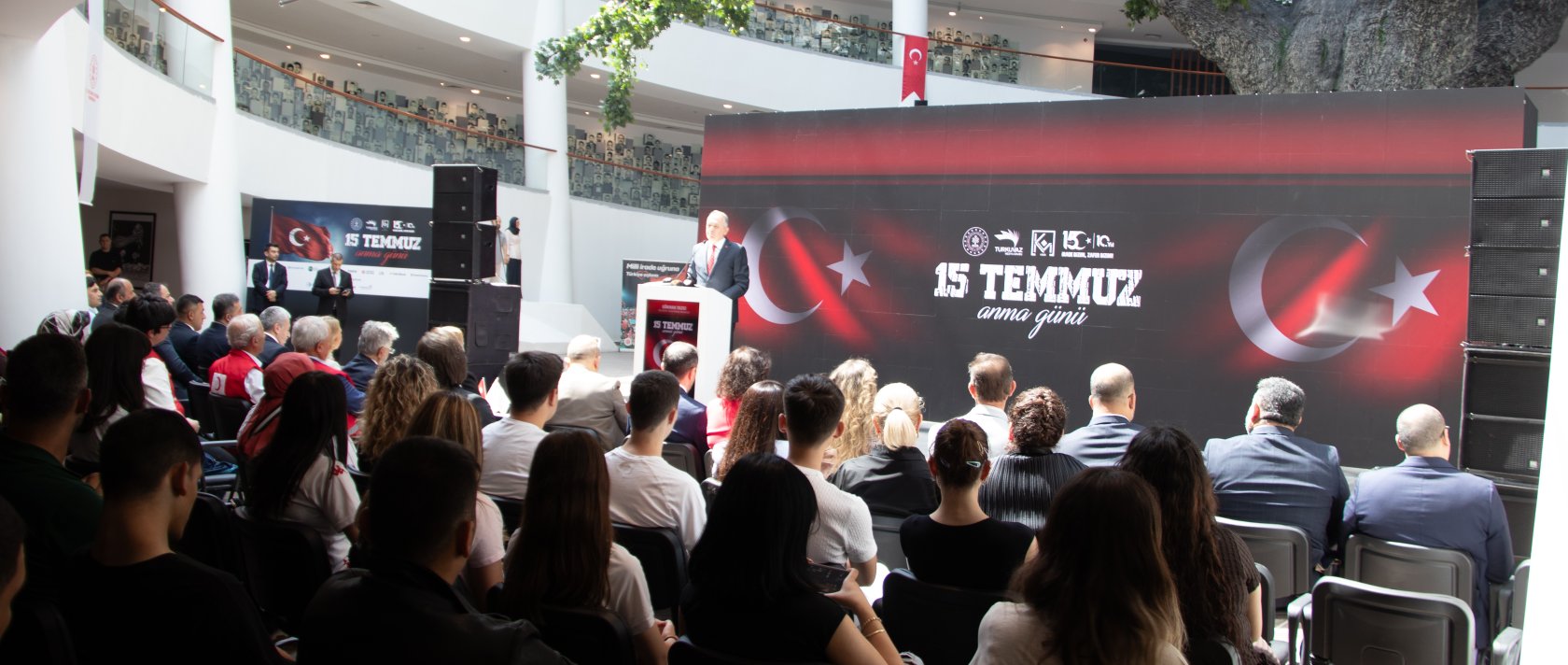 Deputy Culture and Tourism Minister Gökhan Yazgı speaks at a Turkuvaz Media Group commemoration marking the anniversary of the July 15 coup attempt, Ankara, Türkiye, July 14, 2026. (Courtesy of Turkuvaz Media Group)