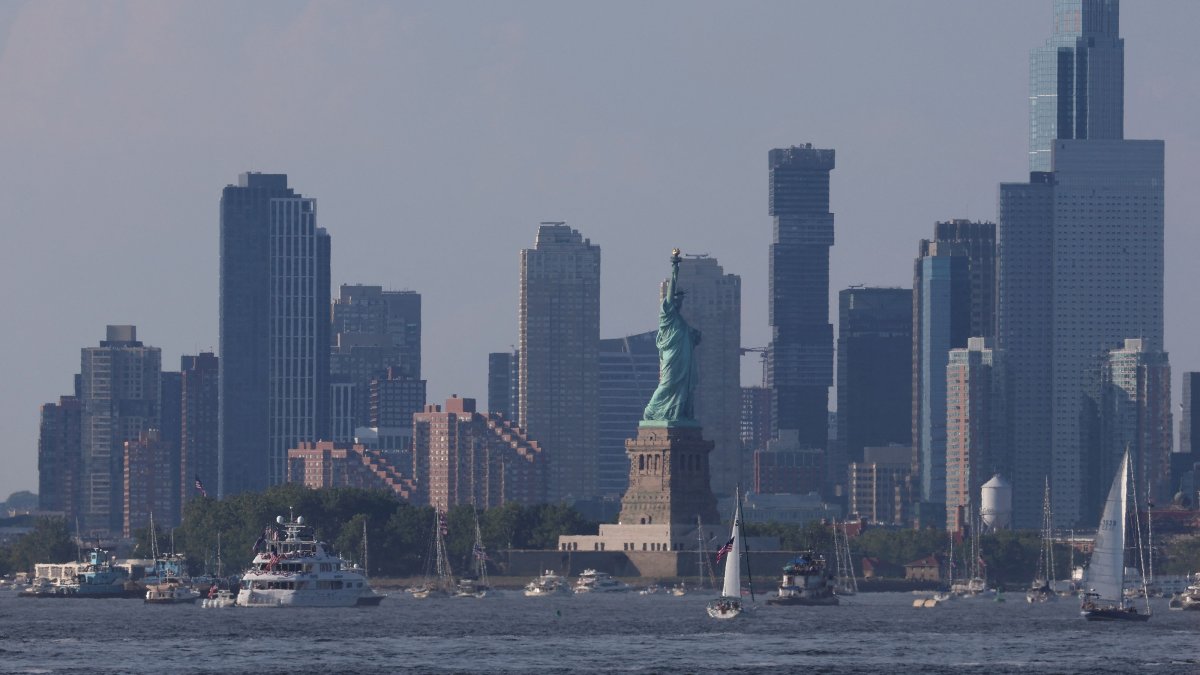 A general view of the Jersey City skyline as boats are moored near The Statue of Liberty, New York City, U.S., July 4, 2026. (AFP Photo)