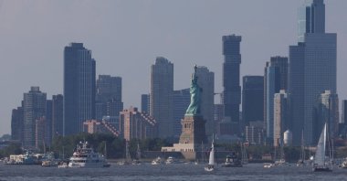 A general view of the Jersey City skyline as boats are moored near The Statue of Liberty, New York City, U.S., July 4, 2026. (AFP Photo)