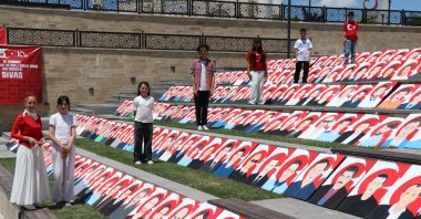 Students from Yavuz Selim Middle School display portraits of July 15 martyrs created over two years, Sivas, Türkiye, July 15, 2026. (AA Photo)