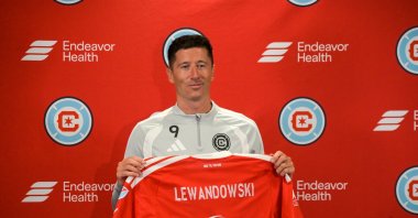 Robert Lewandowski poses with a jersey after being unveiled by the Chicago Fire FC at a press conference at Endeavor Health Performance Center, Chicago, U.S., July 14, 2026. (AA Photo)
