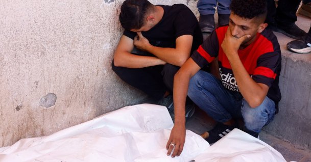 Mourners attend the funeral of Palestinian man Omar Abu Qassem, his wife Asma, and their daughter Habeeba, who were killed in an Israeli strike, at Al-Aqsa Martyrs Hospital in Deir Al-Balah, central Gaza Strip, Palestine, July 15, 2026. (Reuters Photo)