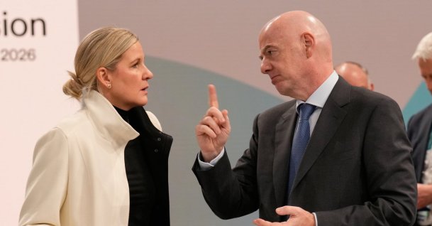 IOC President Kirsty Coventry (L) speaks to FIFA President and IOC member Gianni Infantino during the opening of the IOC Session, ahead of the 2026 Winter Olympics, Milan, Italy, Feb. 3, 2026. (AP Photo)