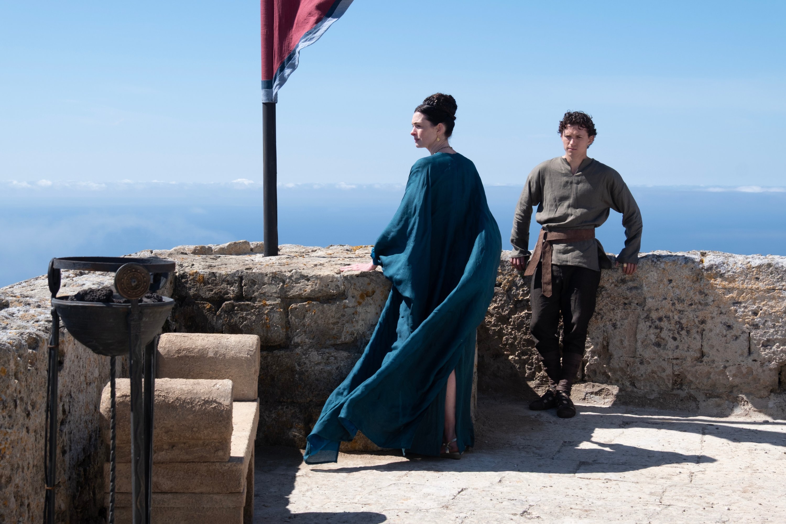 This image released by Universal Pictures shows Anne Hathaway as Penelope and Tom Holland as Telemachus, in a scene from