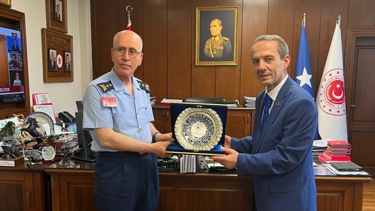 Turkish National Defence Ministry General Director of Personnel Major General Orhan Gürdal (L) poses for a photo with Turkish Wushu Kung Fu Federation president Abdurrahman Akyüz after signing a cooperation agreement, Ankara, Türkiye, July 14, 2026. (AA Photo)