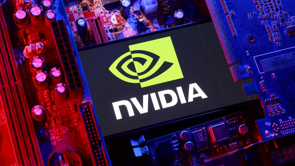 An NVIDIA logo and a computer motherboard appear in this illustration taken Aug. 25, 2025. (Reuters Photo)