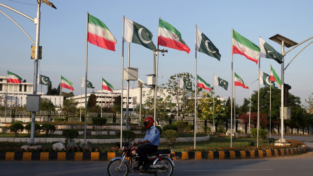 Pakistani and Iranian flags are displayed outside the President's House in Islamabad, Pakistan, 22 June 2026, ahead of Iranian President Masoud Pezeshkian’s expected official visit to the Pakistani capital.  EPA/SOHAIL SHAHZAD