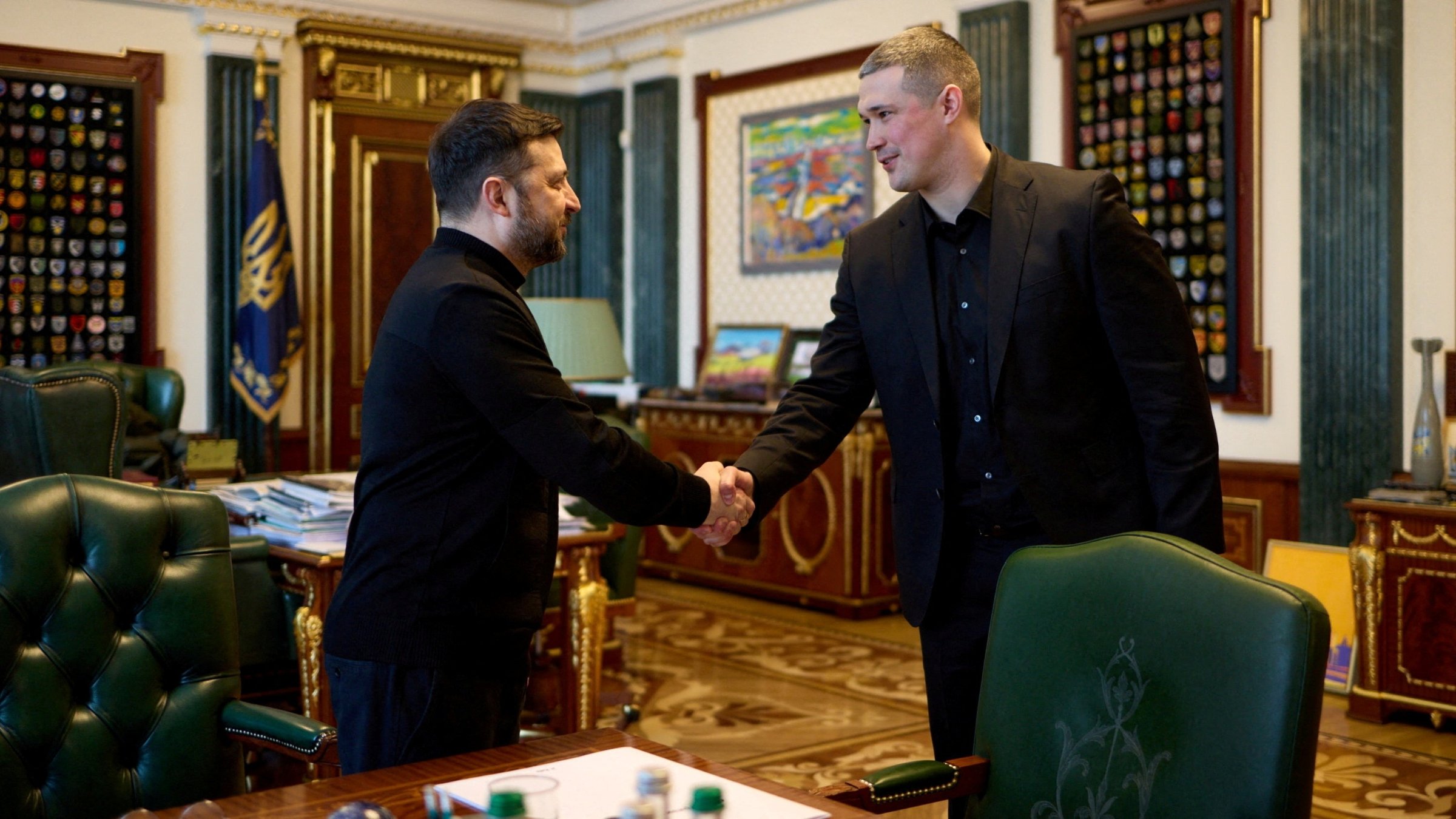 Ukraine's President Volodymyr Zelenskyy and then-newly appointed Defense Minister Mykhailo Fedorov shake hands before their meeting, Kyiv, Ukraine, Jan. 14, 2026. (Reuters Photo)