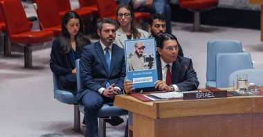 Danny Danon, Israel's permanent representative to the United Nations, shows a photograph of Al-Jazeera cameraperson Ahmed Wishah, who was killed in Israeli strikes, during a U.N. Security Council meeting at U.N. headquarters, New York, U.S., June 29, 2026. (EPA Photo)