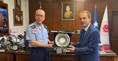 Turkish National Defence Ministry General Director of Personnel Major General Orhan Gürdal (L) poses for a photo with Turkish Wushu Kung Fu Federation president Abdurrahman Akyüz after signing a cooperation agreement, Ankara, Türkiye, July 14, 2026. (AA Photo)