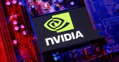 An NVIDIA logo and a computer motherboard appear in this illustration taken Aug. 25, 2025. (Reuters Photo)