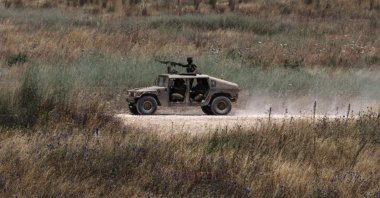 An Israeli military vehicle operates in southern Lebanon, as seen from the Israeli side of the border in the Upper Galilee, northern Israel, June 17, 2026. (EPA Photo)