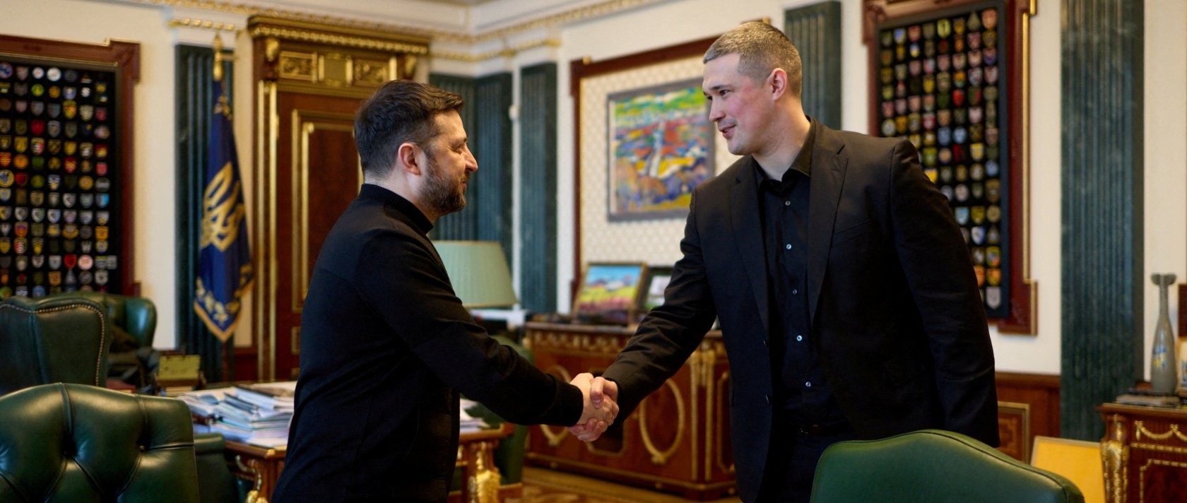 Ukraine's President Volodymyr Zelenskyy and then-newly appointed Defense Minister Mykhailo Fedorov shake hands before their meeting, Kyiv, Ukraine, Jan. 14, 2026. (Reuters Photo)