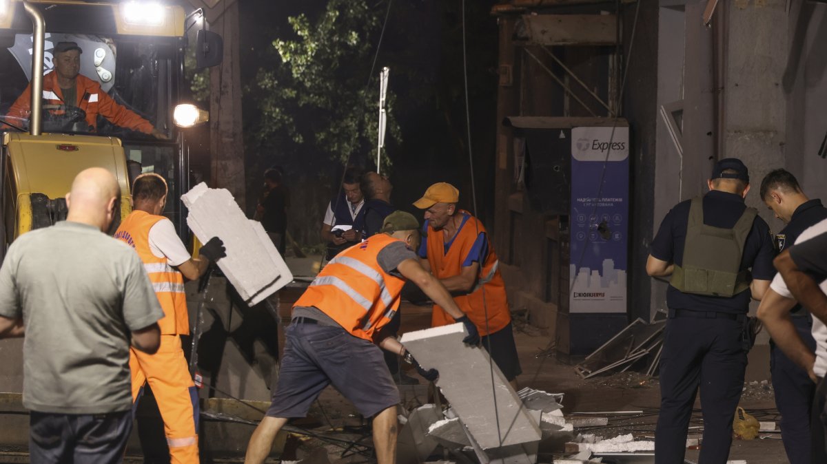 Communal workers clean debris at the site of a Russian strike on a residential area, Odesa, Ukraine, July 16, 2026. (EPA Photo)