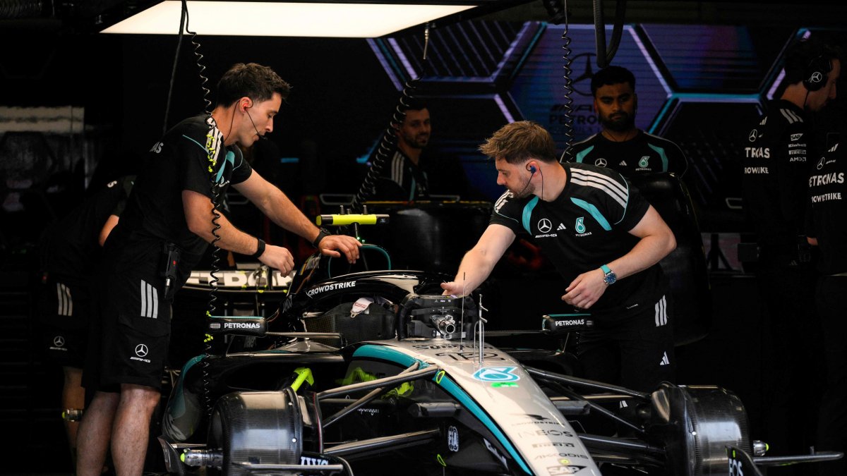 Mechanics work on the car of Mercedes' Italian driver Kimi Antonelli in the paddock before the first practice session at the Spa-Francorchamps circuit ahead of the Formula One Belgian Grand Prix, Spa, Belgium, July 17, 2026. (AFP Photo)