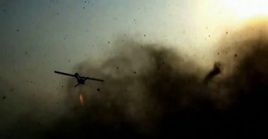 This screen grab taken on July 15, 2026, from video footage released by Iran's Revolutionary Guards (IRGC)'s Sepah News website on July 14, 2026, allegedly shows a drone being launched from an undisclosed location towards US targets in Bahrain and Kuwait. (AFP Photo)