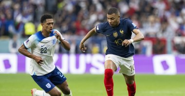 England's Jude Bellingham and France's Kylian Mbappe during the 2022 Qatar World Cup quarterfinal match at Al Bayt Stadium, Al Khor, Qatar, Dec. 10, 2022. (Getty Images Photo)