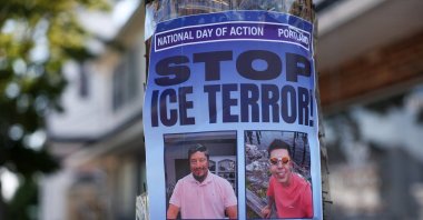 A poster calling for a national day of action against ICE hangs near a makeshift street-side memorial for Johan Sebastian Duran, a driver who was fatally shot on July 13 by U.S. Immigration and Customs Enforcement (ICE) agents, Biddeford, U.S., July 16, 2026. (Reuters Photo)