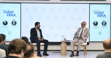 Sadullah Uzun, (R) director general of national technology and artificial intelligence at the Ministry of Industry and Technology, speaks during a panel on Türkiye's Artificial Intelligence Action Plan, Istanbul, Türkiye, July 16, 2026. (AA Photo)