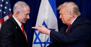 U.S. President Donald Trump points his finger toward Israeli Prime Minister Benjamin Netanyahu as they shake hands during a press conference after meeting at Trump's Mar-a-Lago club in Palm Beach, Florida, U.S., Dec. 29, 2025. (Reuters Photo)