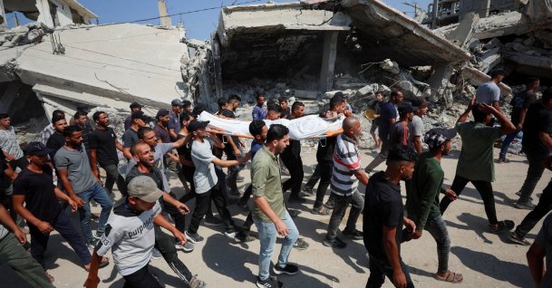 Mourners react while carrying a body during the funeral of three Palestinians, who were killed in an Israeli strike, according to medics, Gaza City, Palestine, July 16, 2026. (Reuters Photo)