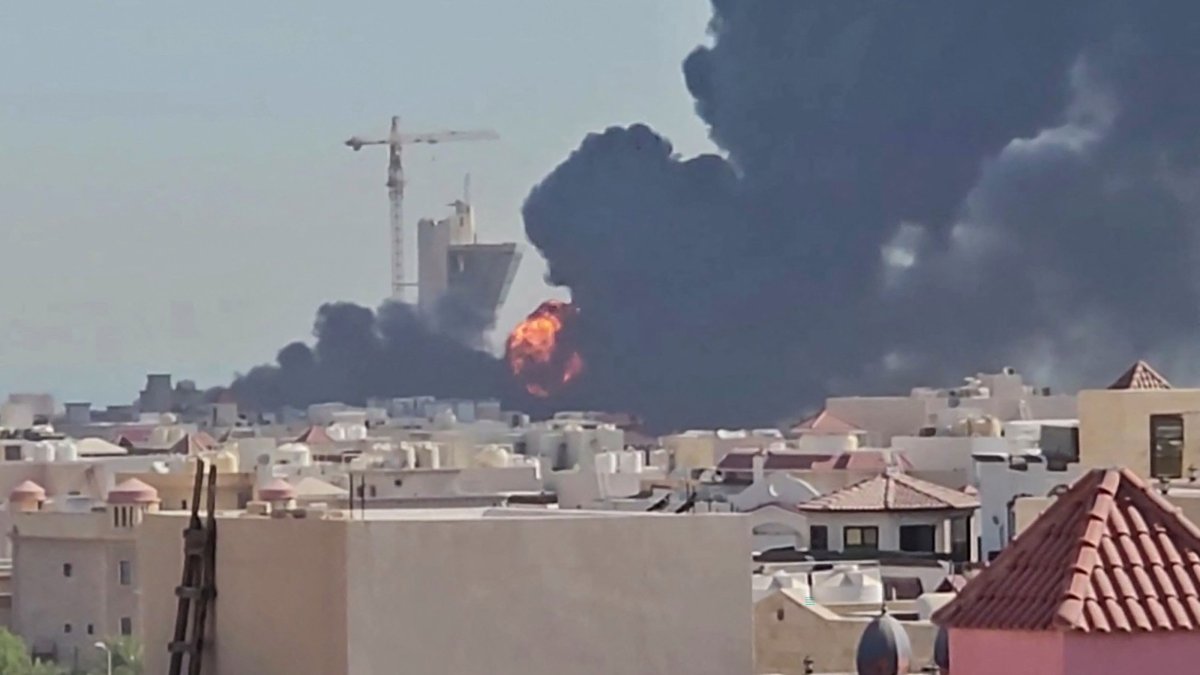 This screen grab, taken from UGC video footage posted on social media on July 18, 2026, shows a plume of black smoke and flames billowing over the town of Mangaf, Kuwait City, Kuwait. (AFP Photo)