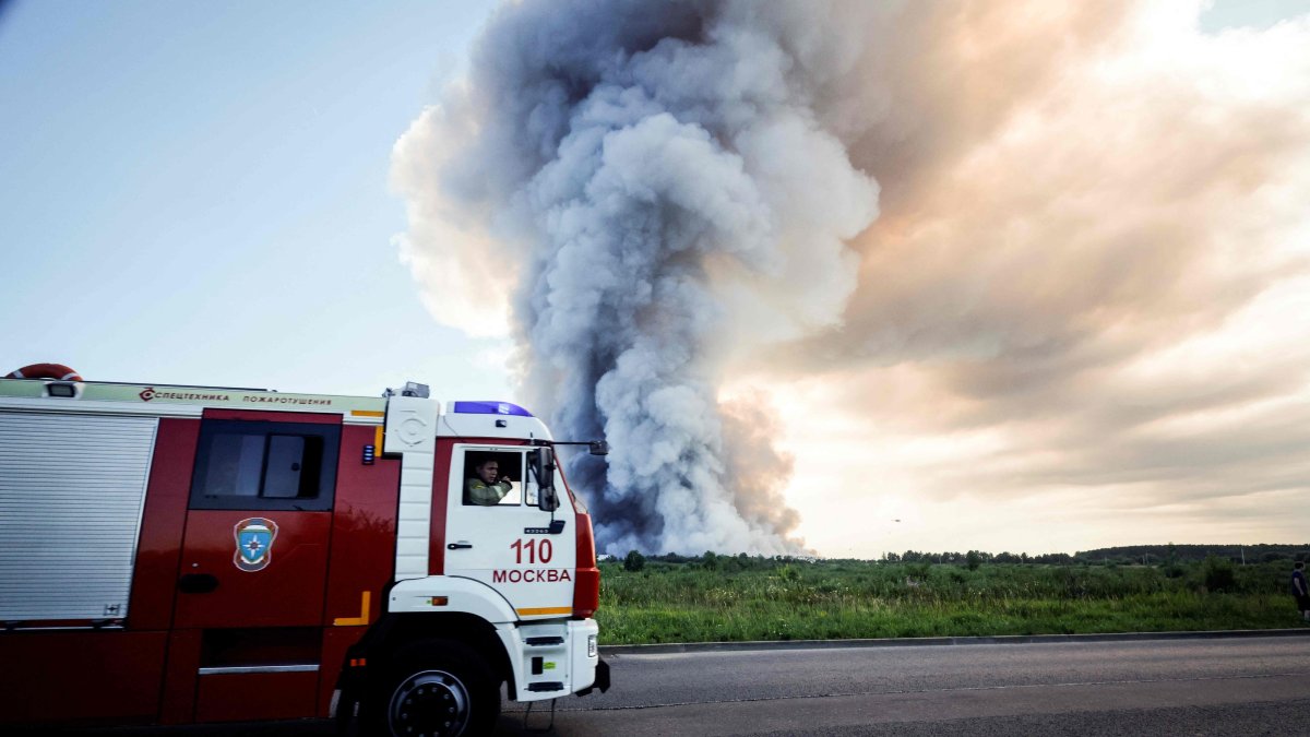 Firefighters drive past the smoke of a fire at the Russian e-commerce firm Wildberries' logistics complexes in the town of Elektrostal, Moscow, Russia, July 18, 2026. (AFP Photo)