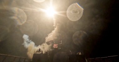 A U.S. warship launches a munition at an unknown location during what the U.S. military says is its latest wave of strikes on Iran, hitting "Iranian military targets such as coastal surveillance and air defense sites, military logistics infrastructure, and maritime capabilities," in this still image taken from a handout video released July 16, 2026. (Reuters Photo)