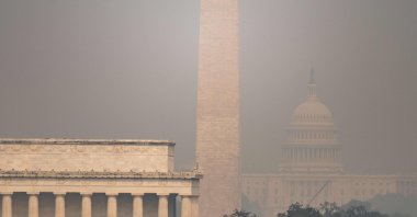 The US Capitol, Washington Monument and Lincoln Memorial are seen through haze caused by wildfire smoke from Canada from the Netherlands Carillon, Arlington, U.S., July 17, 2026. (AFP Photo)