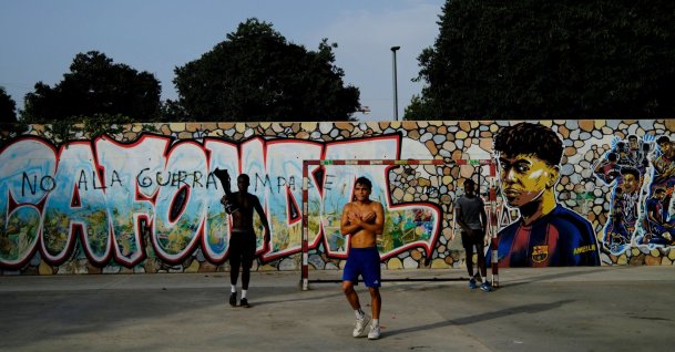 Residents play football in a park as one of them does Lamine Yamal's trademark "304" hand gestures after scoring goals, a reference to the neighborhood's postal code, at the Rocafonda neighborhood in Mataro, Barcelona, Spain, July 16, 2026. (Reuters Photo)
