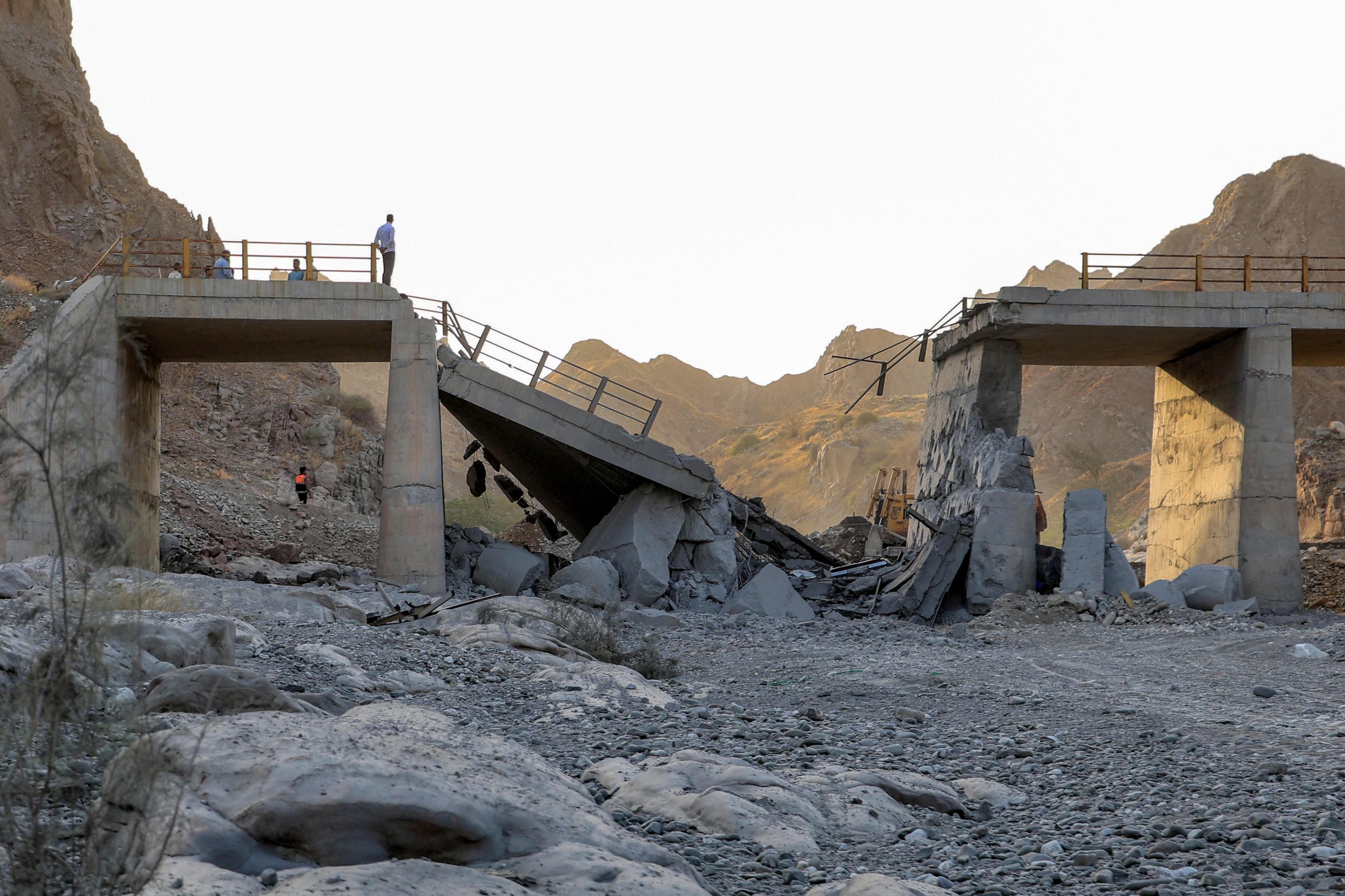A heavily damaged bridge, which was hit by a US strike, is pictured along the road connecting Roudan and Bandar Abbas in southern Iran, July 18, 2026. (AFP Photo)