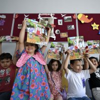 Students hold their report cards as the 2025-2026 academic year comes to an end, Ankara, Türkiye, June 26, 2026. (AA Photo)