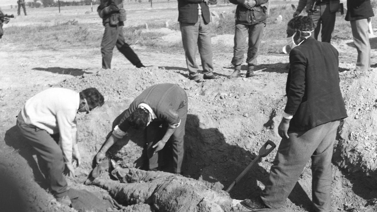 In this undated photo, Turkish Cypriots unearth a mass grave of people killed by EOKA terrorists in a village of Lefkoşa (Nicosia), Cyprus. (AA Photo)
