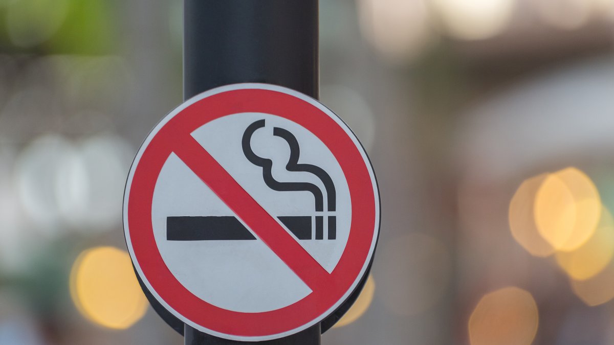 A no-smoking sign is displayed on a wall. (Shutterstock Photo)