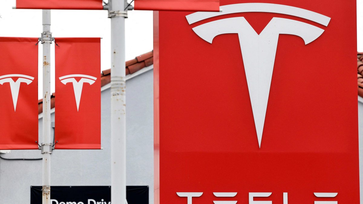 The Tesla logo is displayed at a Tesla dealership, Alhambra, California, U.S., July 2, 2026. (AFP Photo)