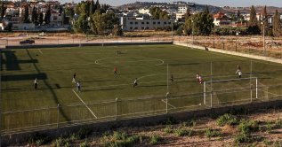 Palestinian teens play football in Turmus Ayya, northeastern Ramallah, with the Israeli settlement of Shilo visible in the background, occupied West Bank, Palestine, June 28, 2026. (AFP Photo)