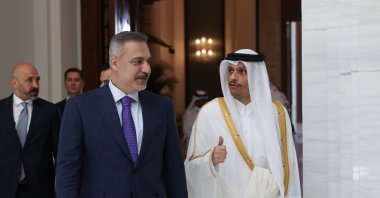 Foreign Minister Hakan Fidan (L) walks with Qatar's Prime Minister and Foreign Minister Sheikh Mohammed bin Abdulrahman Al Thani before their meeting, Doha, Qatar, July 19, 2026. (AA Photo)