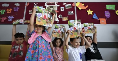 Students hold their report cards as the 2025-2026 academic year comes to an end, Ankara, Türkiye, June 26, 2026. (AA Photo)
