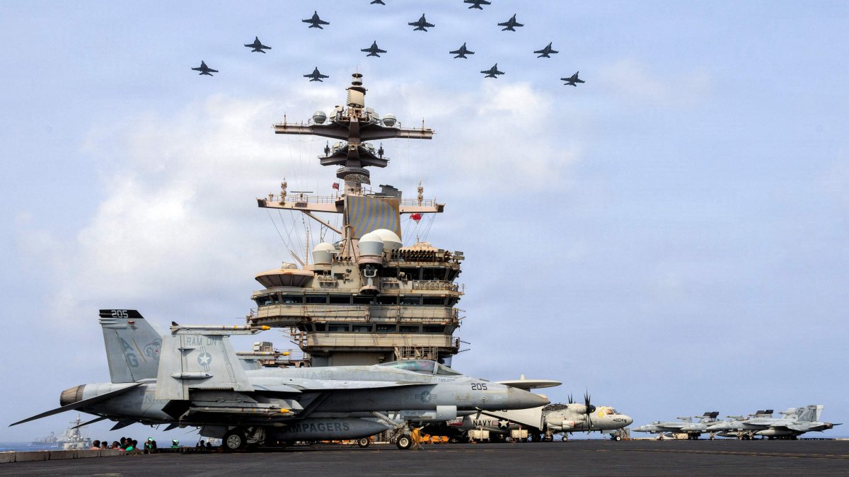 The Carrier Air Wing (CVW) 7 flying in formation over the USS George H.W. Bush (CVN 77), Arabian Sea, June 30, 2026. (AFP Photo)