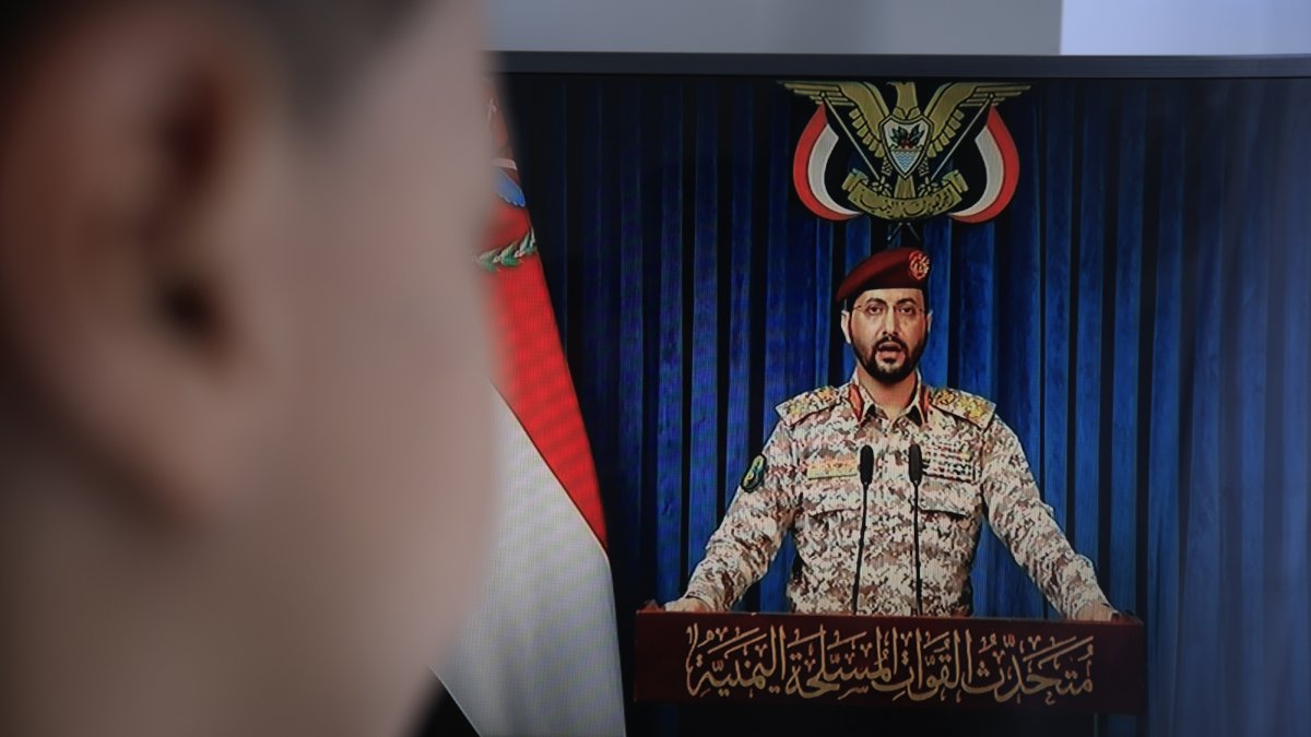A person watches Houthi military spokesperson Yahya Sarea deliver a televised statement in Sanaa, Yemen, July 20, 2026. (EPA Photo)